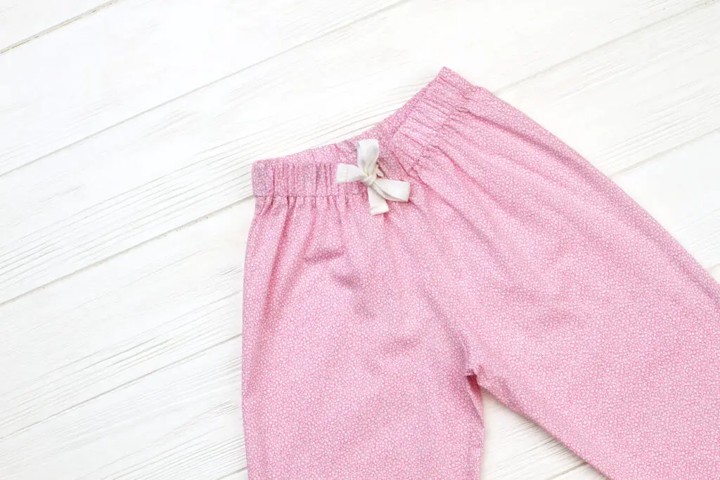 Pink trousers with elastic and drawstring waistband