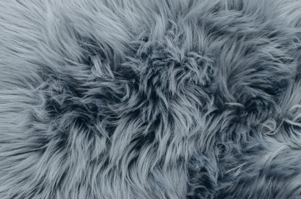 Grey or blue furry fabric. Furry fabric can be difficult to sew. 